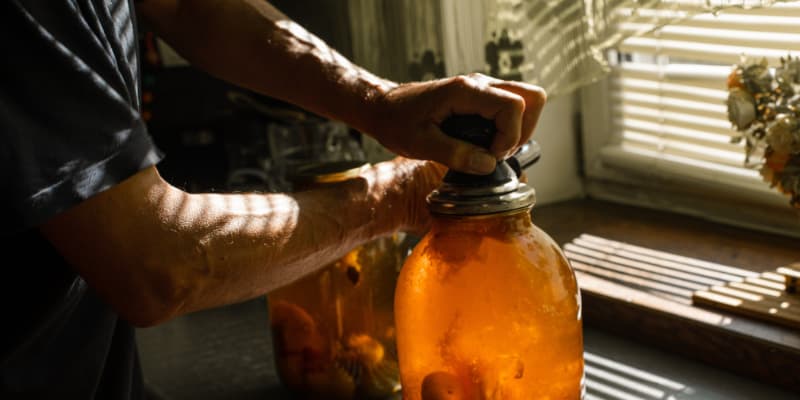 Brewing a large batch in a glass jar allows the flavors of ginger, sugar, and water to meld before bottling.